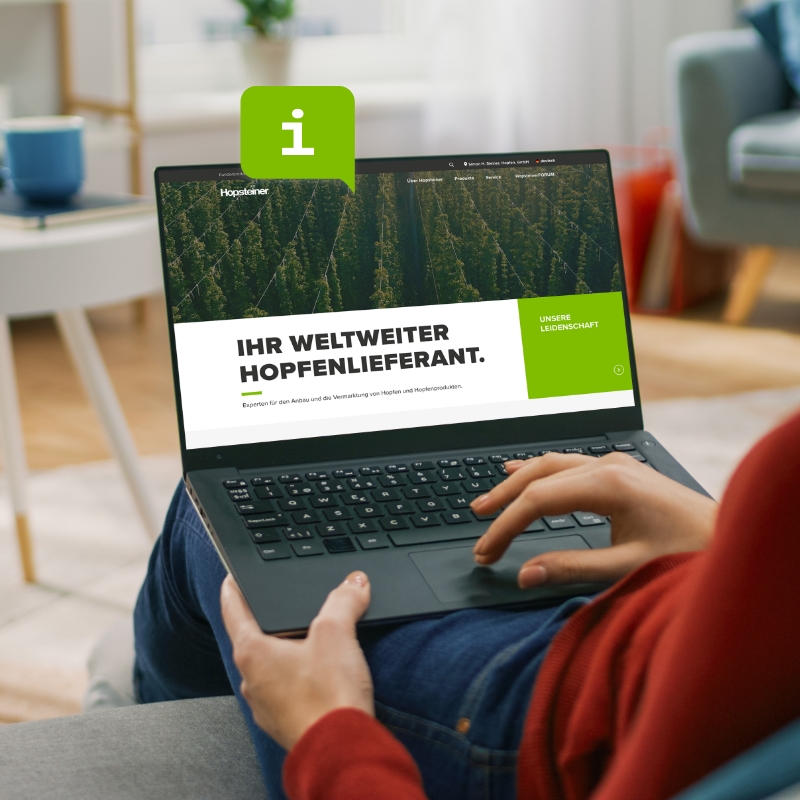 A person with a laptop visits the Hopsteiner website.