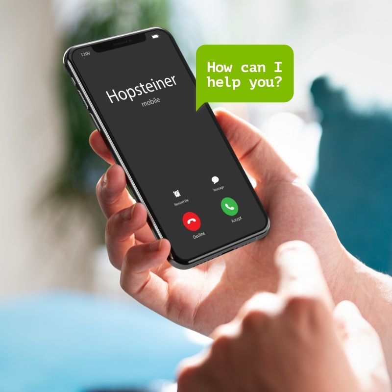 A person calls the Hopsteiner support hotline with their mobile phone.